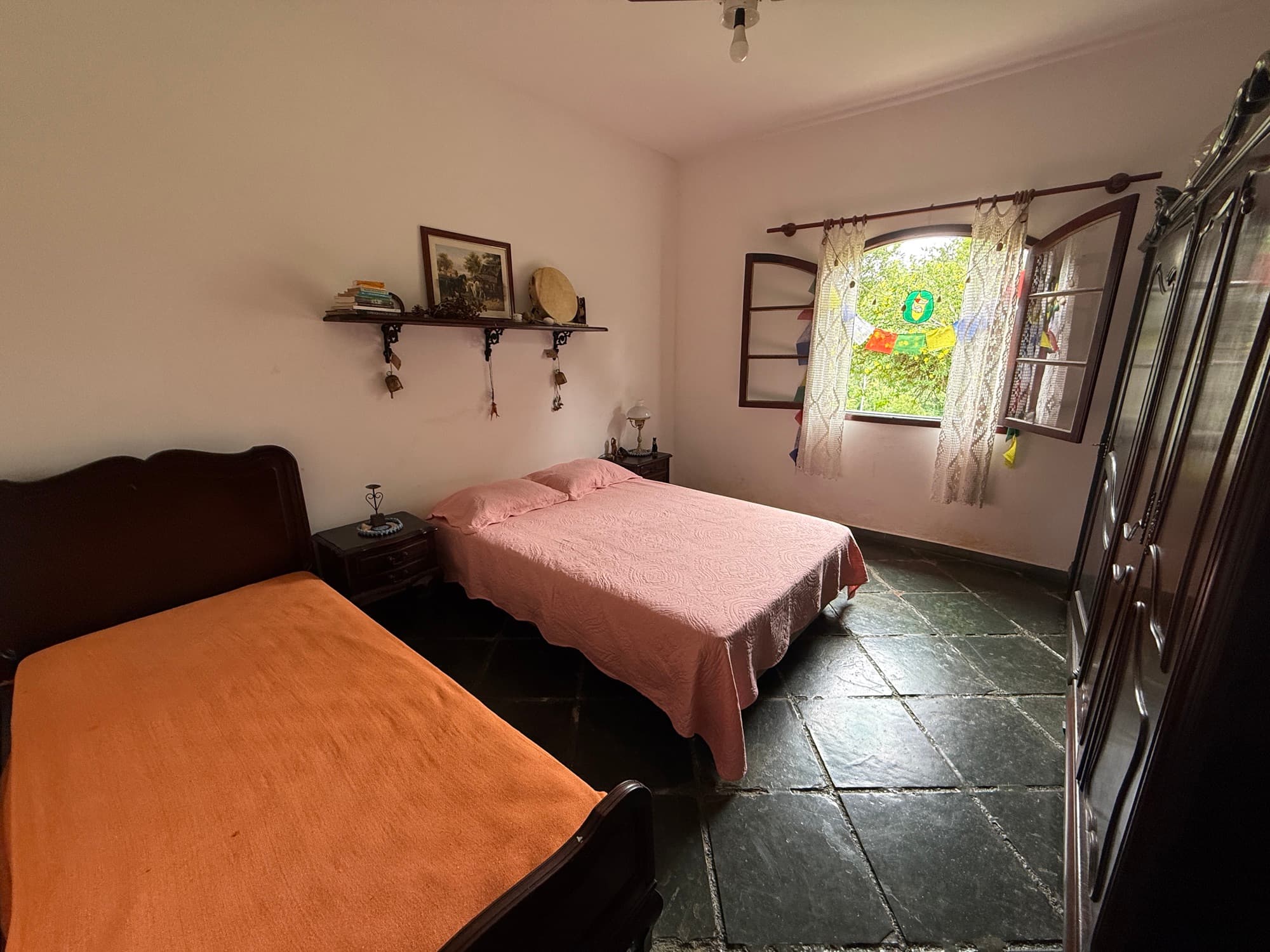 Example of a semi-private room with a queen and additional beds.