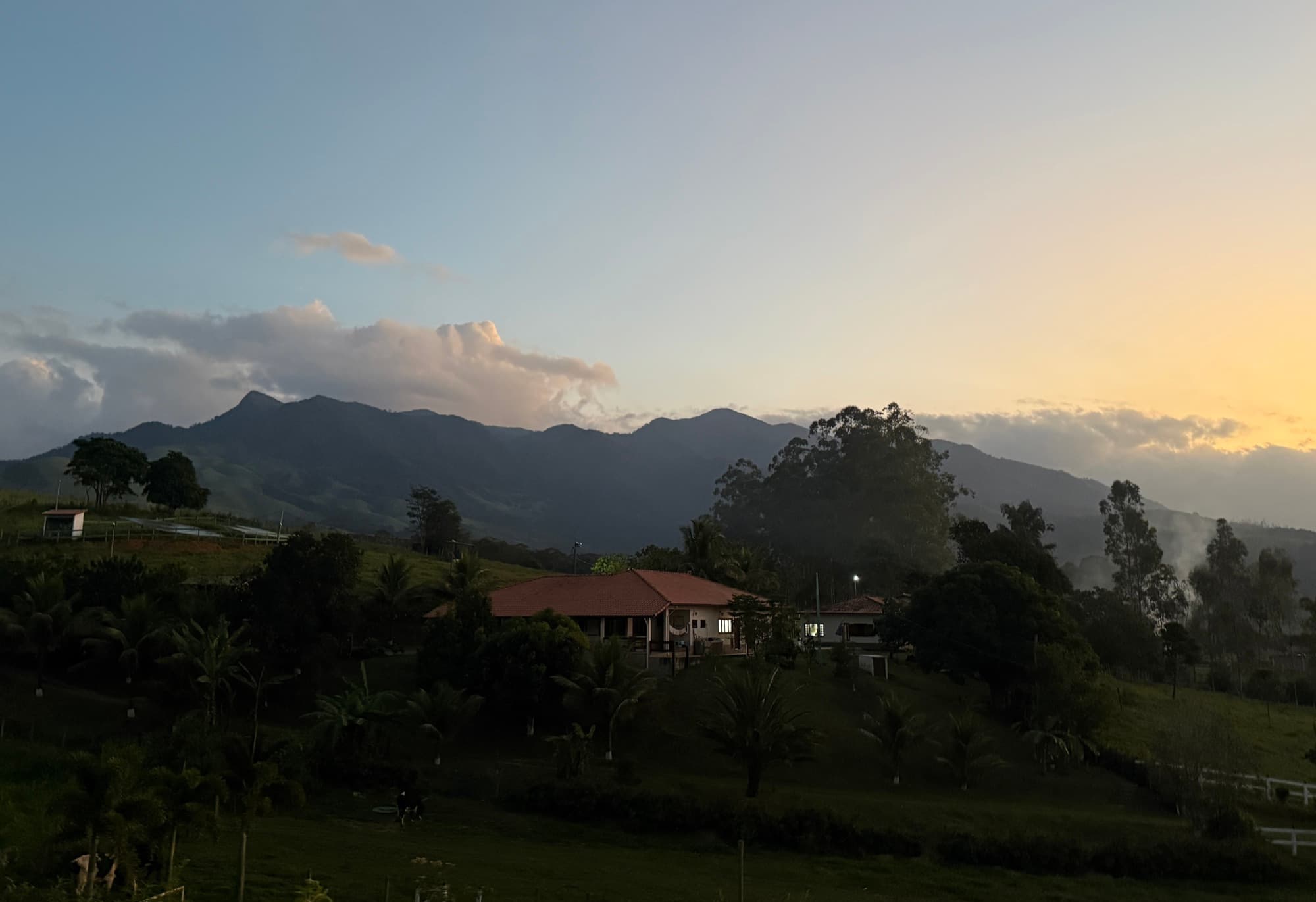 Dusk settling over the mountains beyond the farm.